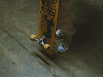 Abstract shot of feet in motion on a wooden floor.