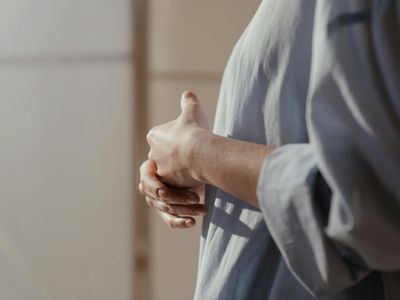Close-up of hands in a mindful gesture.