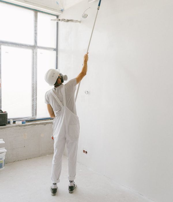 Person practicing light movements in a bright, spacious room.