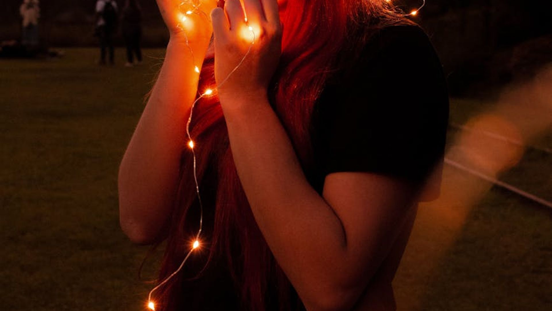 Silhouette of a person in a dynamic pose against a dark background.